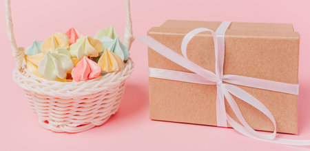 Gifts with sweets on isolated pink background, love and valentine conceptの写真素材