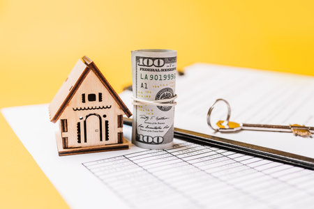 House miniature model and money on documents. Investment, real estate, home, housingの写真素材