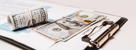 Money and business documents in the office. Investments, taxes, earnings, payments, finance conceptの写真素材