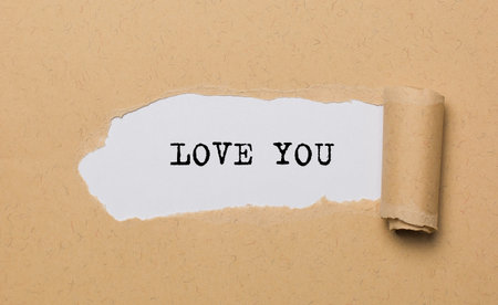 I love you on torn paper background love and valentine conceptの写真素材