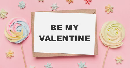 Gifts with note letter on isolated pink background with sweets, love and valentine concept with text be my Valentineの写真素材