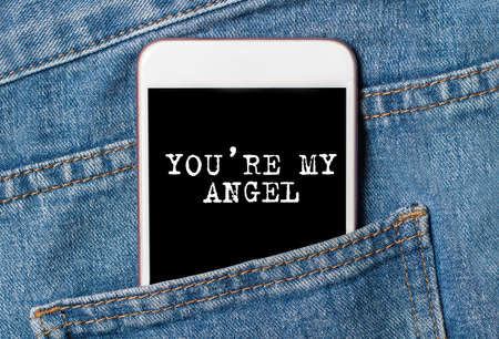 You are my angel on background phone on jeans love and valentine conceptの写真素材