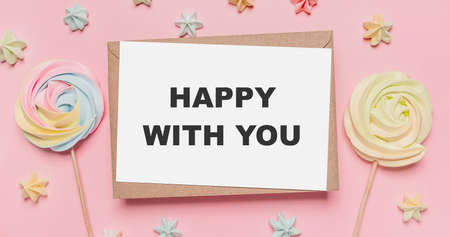 Gifts with note letter on isolated pink background with sweets, love and valentine concept with text happy with youの写真素材