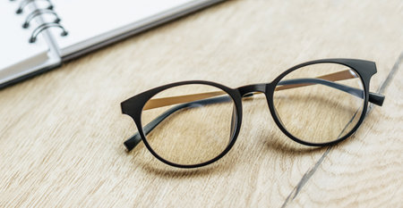 Glasses at the workplace in the office near the notepad. Business hoursの写真素材