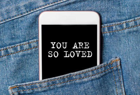 you are so loved on background phone on jeans love and valentine conceptの写真素材