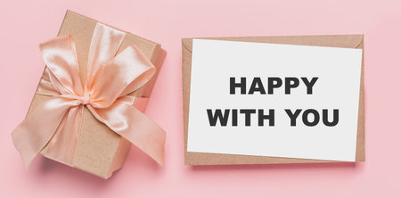 Gifts with note letter on isolated pink background, love and valentine concept with text happy with youの写真素材