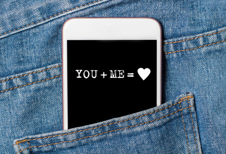 you and me on background phone on jeans love and valentine conceptの写真素材