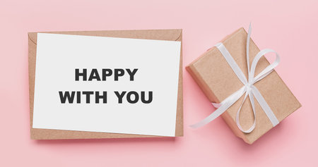 Gifts with note letter on isolated pink background, love and valentine concept with text happy with youの写真素材