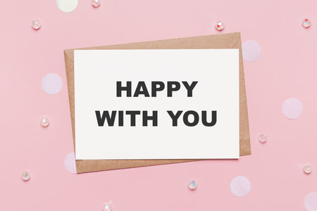 Gifts with note letter on isolated pink background, love and valentine concept with text happy with youの写真素材