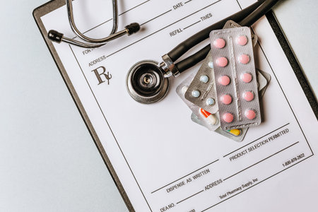 Medical concept with stethoscope, pills, notepad, pen on the doctor desktopの写真素材