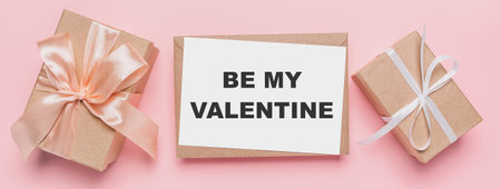 Gifts with note letter on isolated pink background, love and valentine concept with text be my Valentineの写真素材