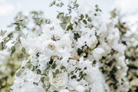 Arch decor with white flowers for a wedding ceremony in natureの写真素材