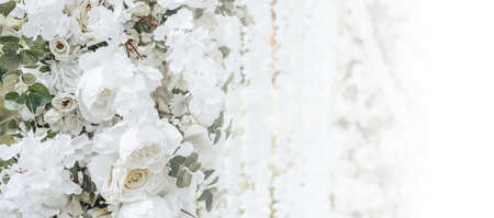 Arch decor with white flowers for a wedding ceremony in natureの写真素材