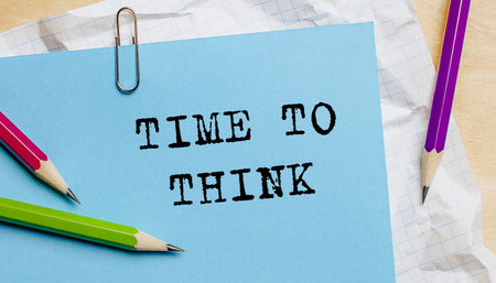 Time To Think text written on a paper with pencils in officeの写真素材