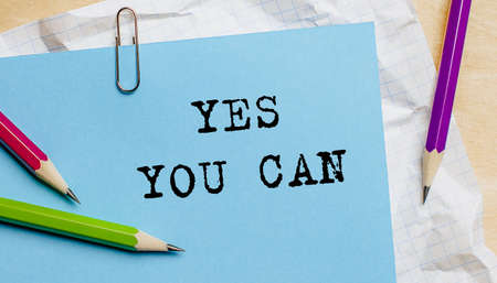 YES YOU CAN text written on a paper with pencils in officeの写真素材