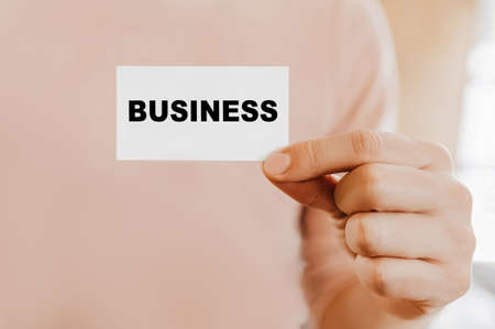 Man holding a business card with businessの写真素材