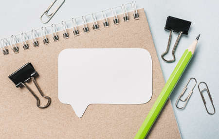 Notepad, white sticker and pensil on the desk. Mock up in copy space office background. It is important not to forget the noteの写真素材