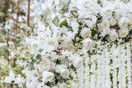 Arch decor with white flowers for a wedding ceremony in natureの写真素材
