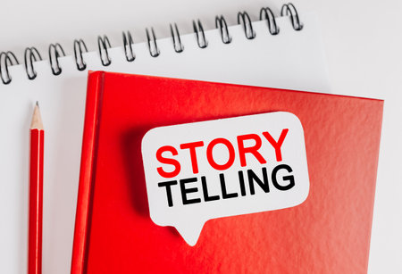 Text Storytelling is the best marketing on a white sticker with office stationery background. Flat lay on business, finance and development conceptの写真素材