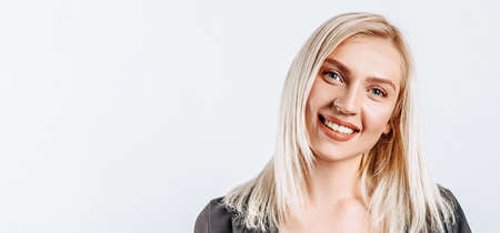 Portrait of a pretty smiling woman posing isolated on a white backgroundの写真素材