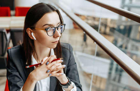 Business woman at the workplace sitting at the table. Manager in the office.の写真素材