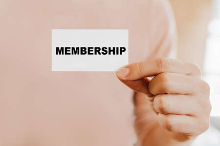 Man holding a business card with Membershipの写真素材