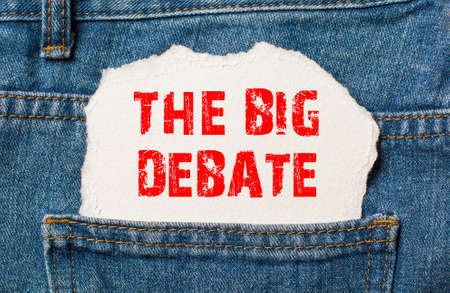 The Big Debate on white paper in the pocket of blue denim jeansの写真素材