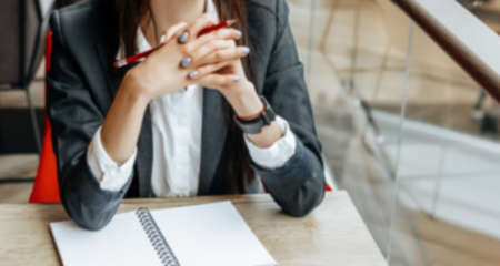 Business woman at the workplace sitting at the table. Manager in the office.の写真素材