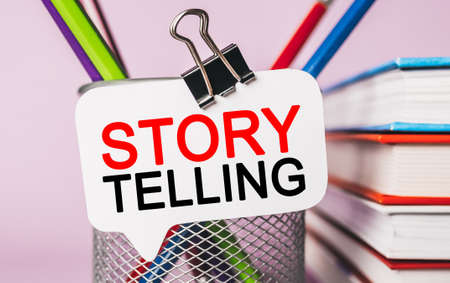 Text Storytelling is the best marketing on a white sticker with office stationery background. Flat lay on business, finance and development conceptの写真素材