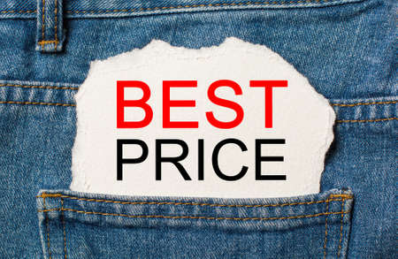 BEST PRICE on torn paper background on jeans business and finance conceptの写真素材