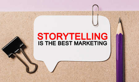 Text Storytelling is the best marketing on a white sticker with office stationery background. Flat lay on business, finance and development conceptの写真素材