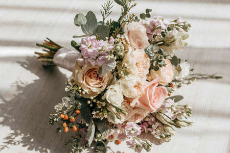Wedding bouquet of peonies flowers on the floor of the newlywedsの写真素材