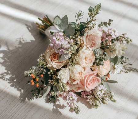 Wedding bouquet of peonies flowers on the floor of the newlywedsの写真素材