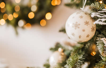 Christmas decorations at home. New year lights, toy, wreath and tree Noelの写真素材
