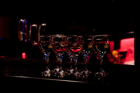 Alcohol cocktails on the bar counter. Nightlife party conceptの写真素材