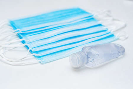 Disposable mask and hand sanitizer to prevent viruses spreading and protect yourself from influenzaの写真素材