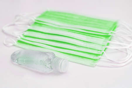 Disposable mask and hand sanitizer to prevent viruses spreading and protect yourself from influenzaの写真素材