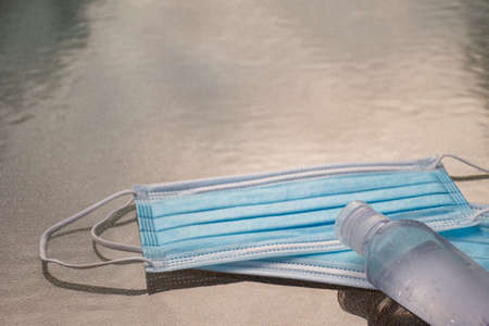 Disposable mask and hand sanitizer to prevent viruses spreading and protect yourself from influenzaの写真素材