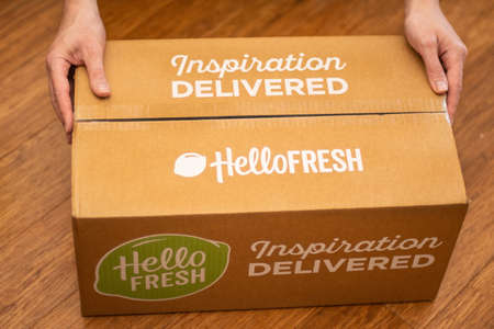 Sydney, Australia 2020-04-25 Hands holding Hello Fresh cardbord box with meal kits