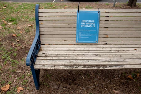 Help stop the spread of COVID-19. Health orders sign on a bench in a public park in NSW, Australia during the pandemic.の写真素材