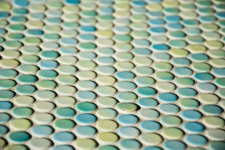 Close up of blurred round colorful tiles - yellow, tourquise and blue. Abstract background .の写真素材