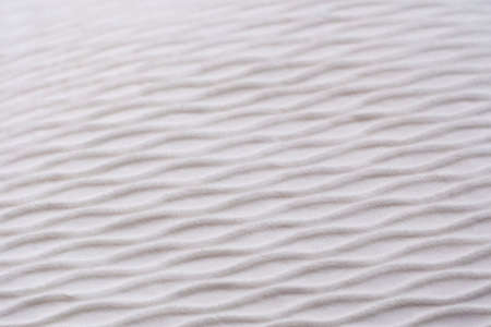 Disfocused soft blurred white rib waves fabric texture backgroundの写真素材