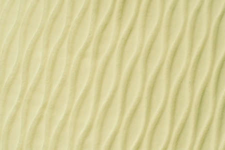 Soft blurred pale yellow rib waves fabric texture backgroundの写真素材