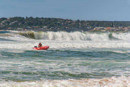 Sydney, Australia 2020-02-15 Surf rescue life savers training in progress. Surf rescue boat jumping on the waves at Wanda Beach, NSW, Australia.のeditorial素材