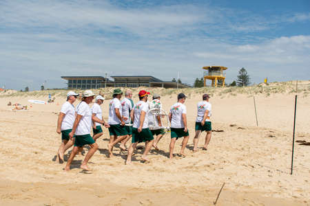 Cronulla, Australia 2020-02-15 Burning Palms Surf Life Saving Club members practicing to march with the surf reelのeditorial素材