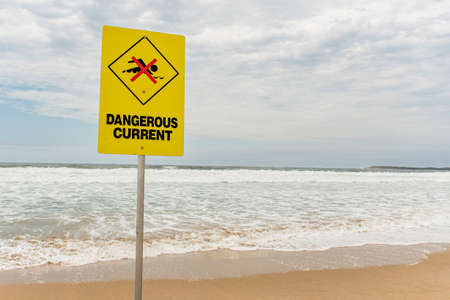 Dangerous current sign for swimmers at the beach in Australiaの写真素材