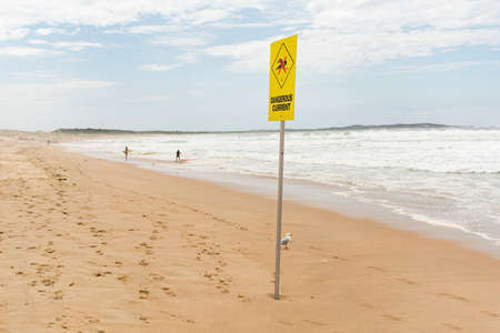 Dangerous current sign for swimmers at the beach in Australiaの写真素材