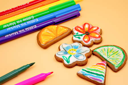 Stay home activities with kids. Decoratiing cookies with edible ink pen markers.の写真素材