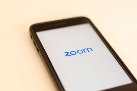 Sydney, Australia - 2020-04-04 Smart phone with zoom application on screen.のeditorial素材