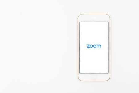Sydney, Australia - 2020-04-06 A smart phone with zoom cloud meetings applicationのeditorial素材